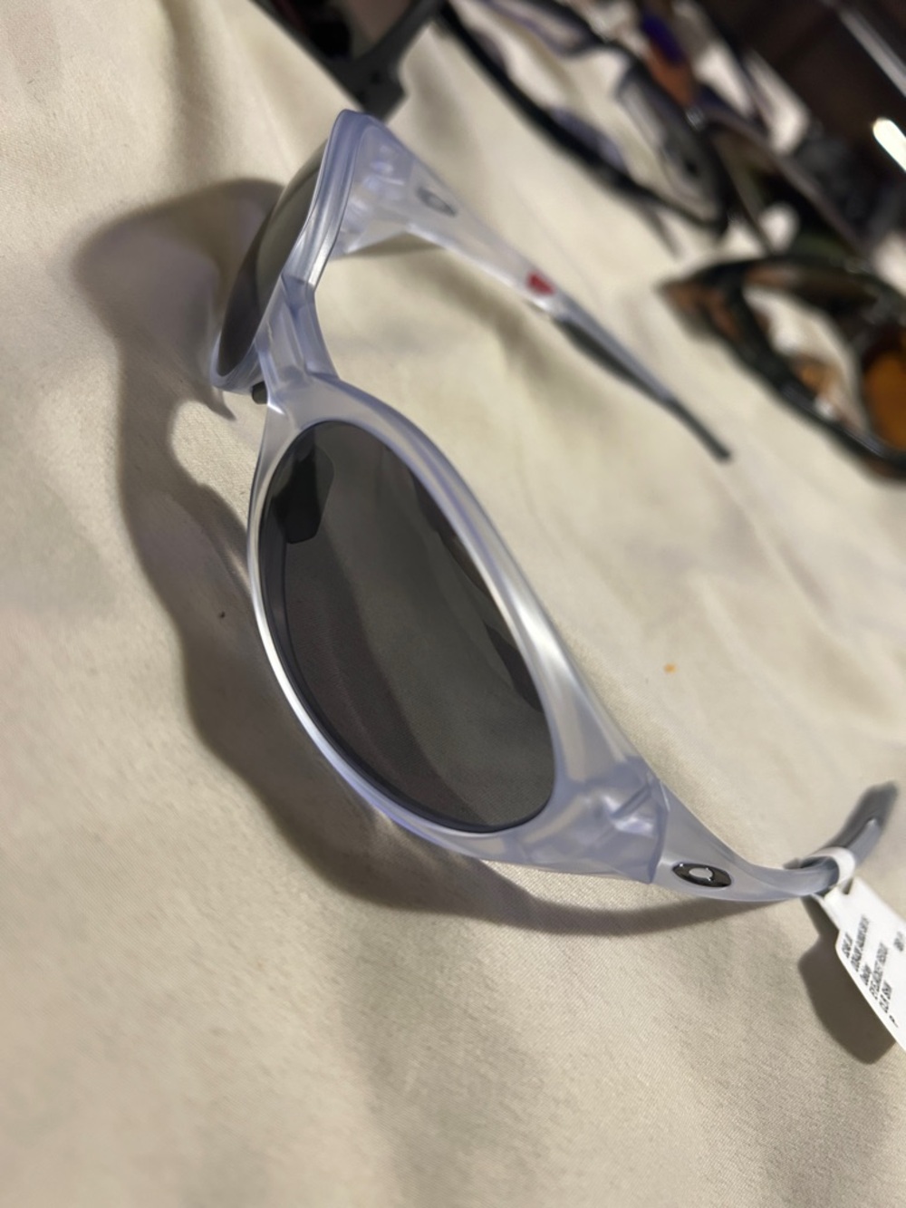 Oakley Translucent Light Purple Frame Sunglasses with Gray Lenses